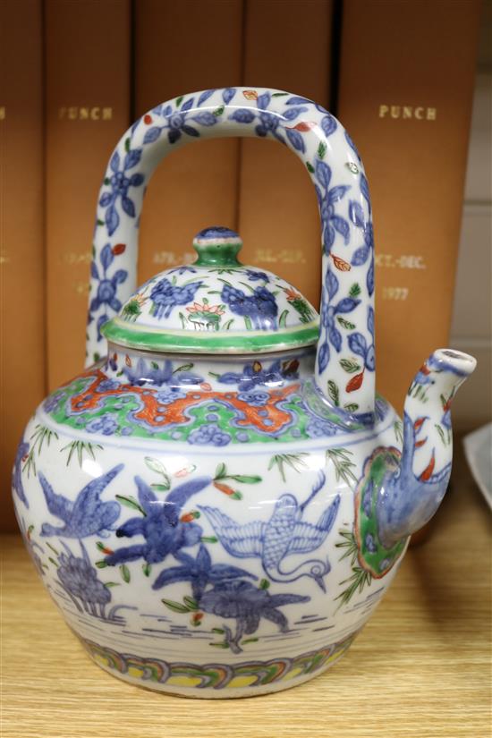 Two Chinese teapots and a cup and saucer Tallest teapot 23cm